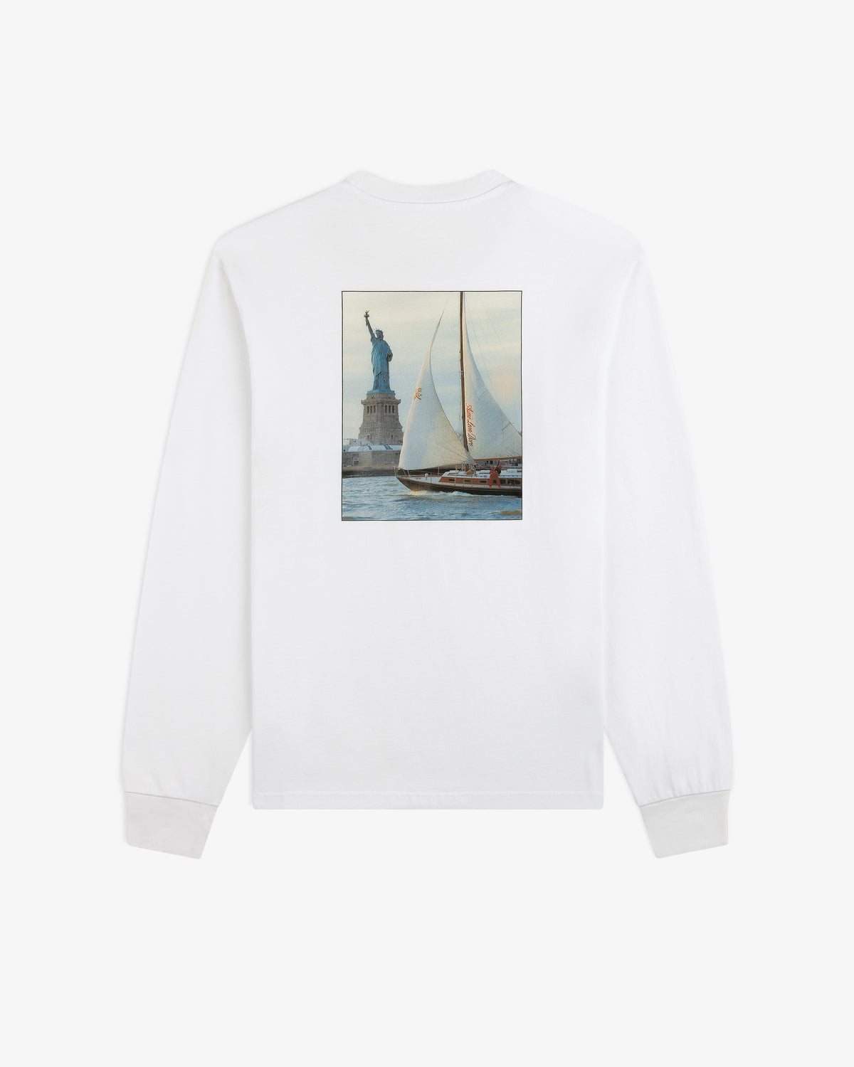 Long-Sleeve Sailing Tee: white long-sleeve shirt with a rectangular back graphic of a sailboat by the Statue of Liberty.