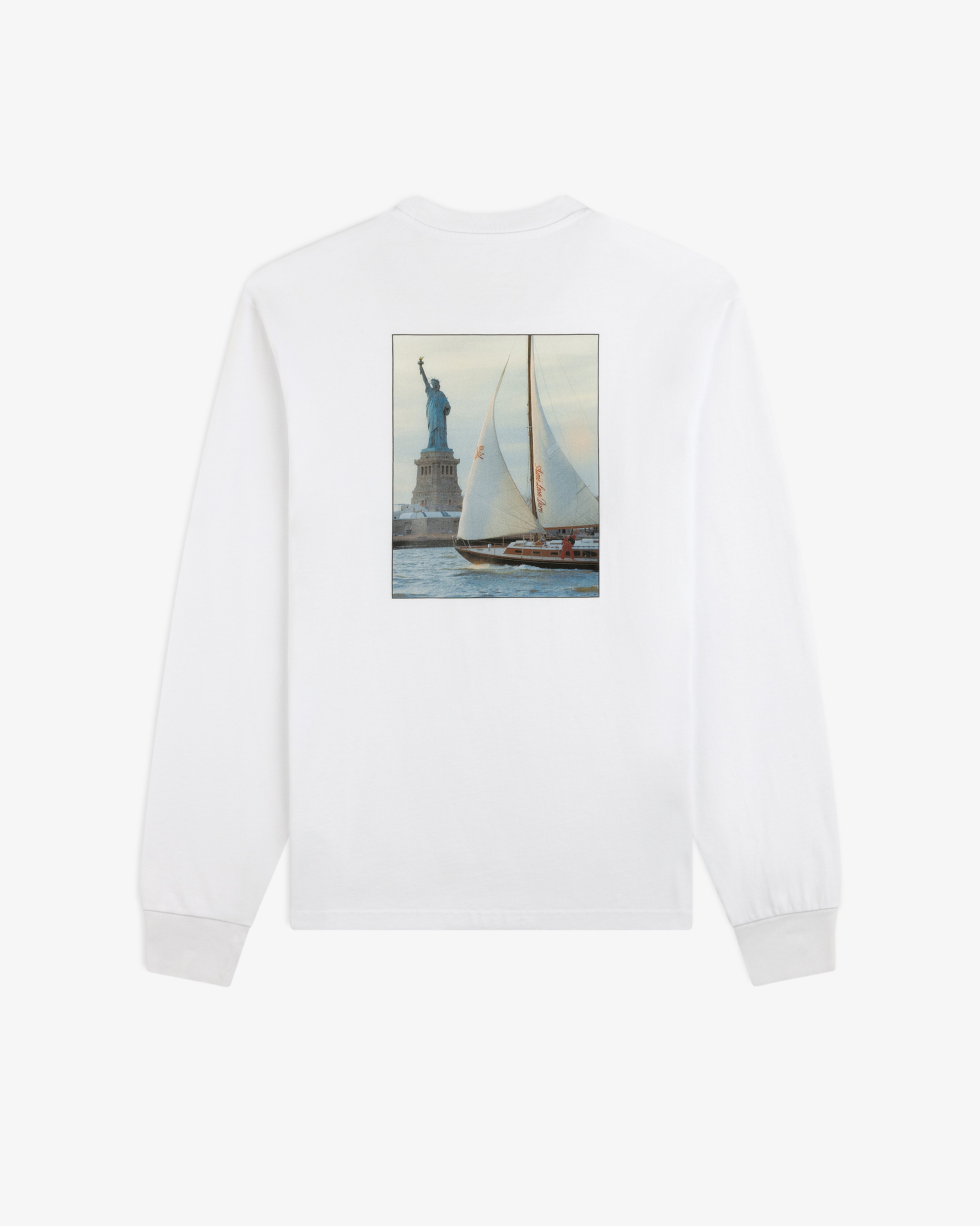 Long-Sleeve Sailing Tee: white long-sleeve shirt with a rectangular back graphic of a sailboat by the Statue of Liberty.