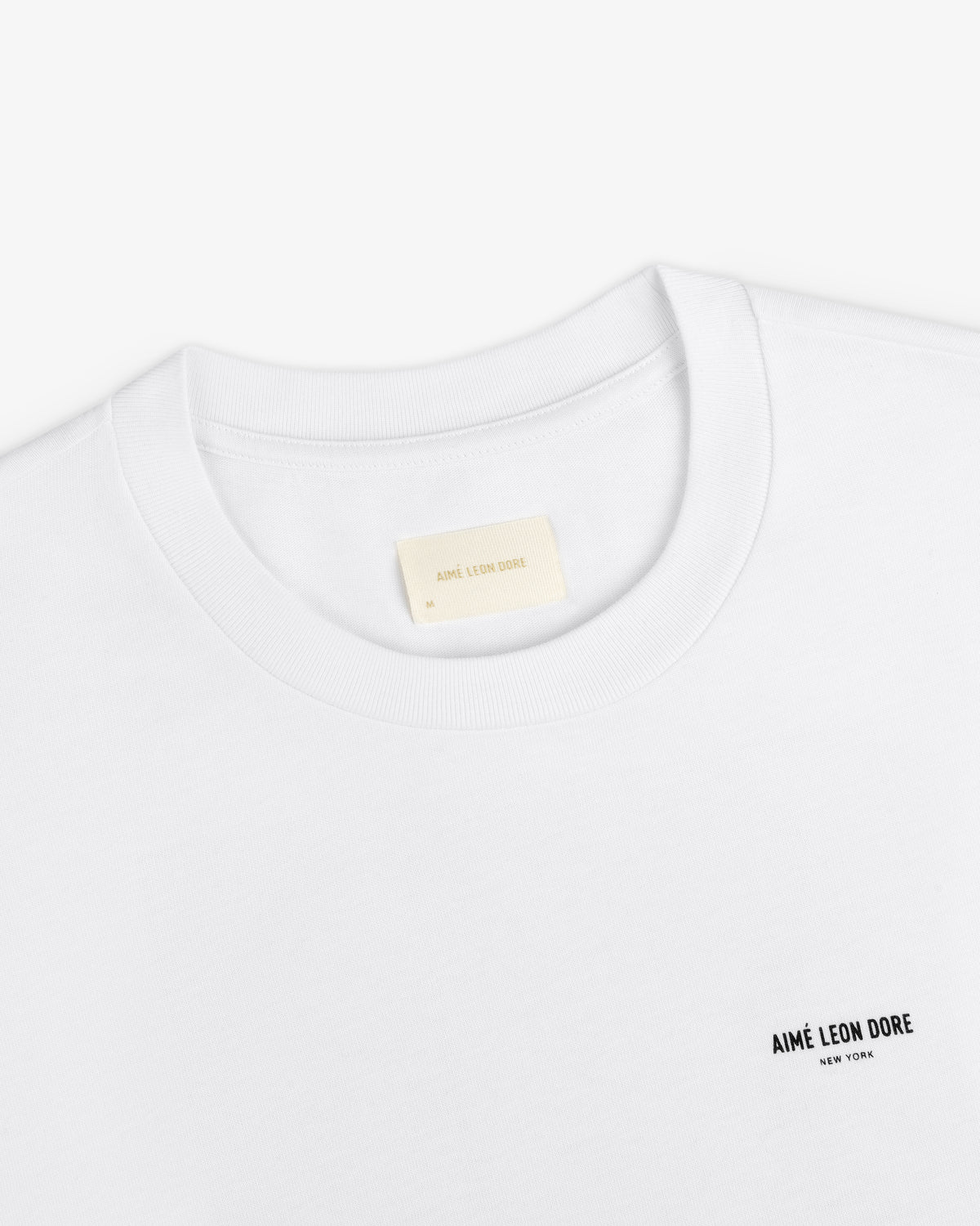 Long-Sleeve Sailing Tee, a white long-sleeve t-shirt with a brand name on the chest and an interior neckline label.