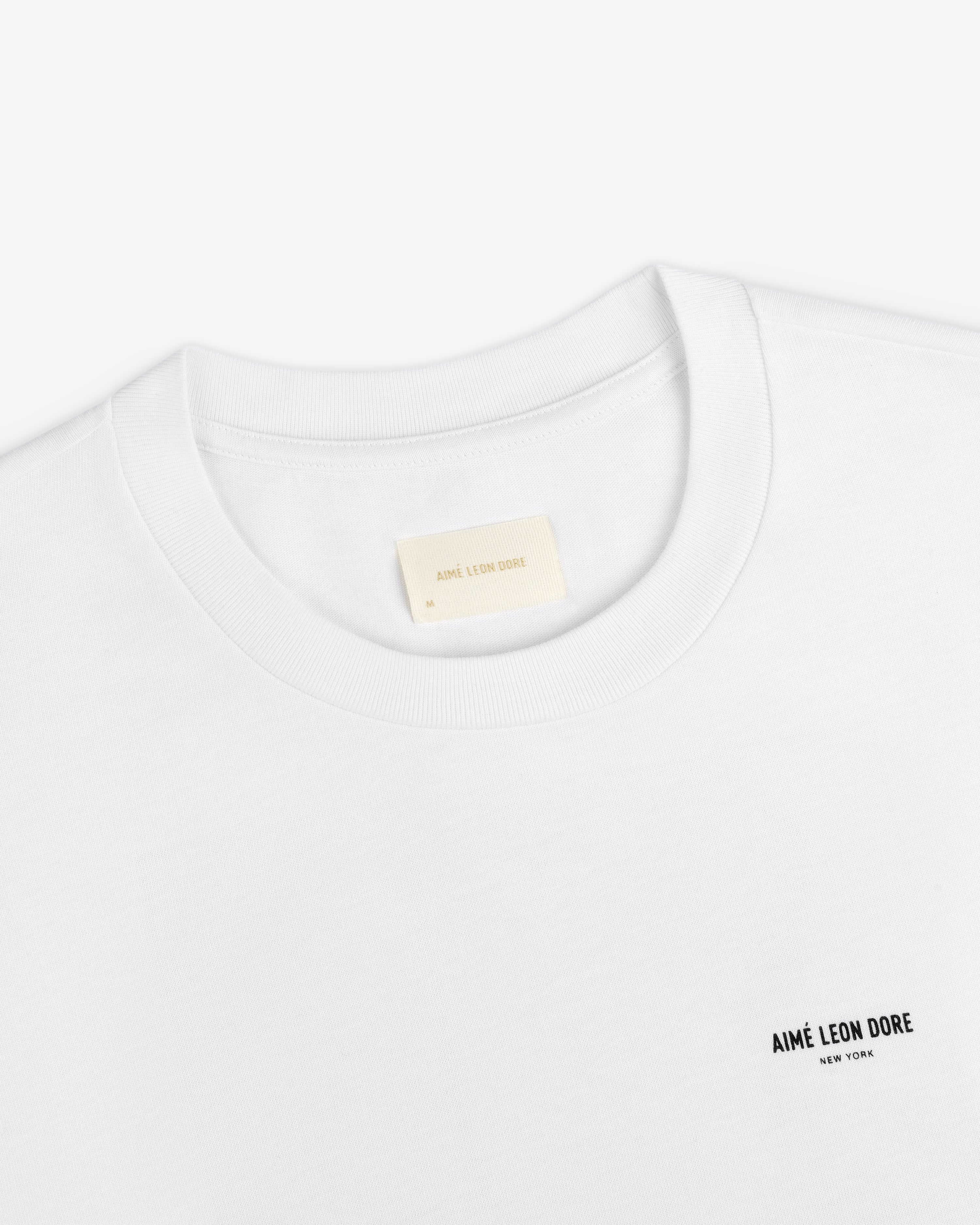 Long-Sleeve Sailing Tee, a white long-sleeve t-shirt with a brand name on the chest and an interior neckline label.
