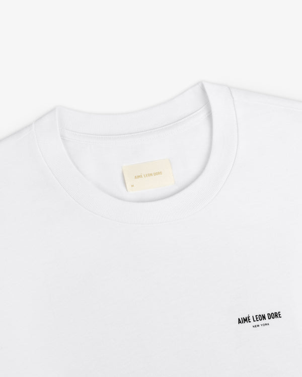 Long-Sleeve Sailing Tee, a white long-sleeve t-shirt with a brand name on the chest and an interior neckline label.
