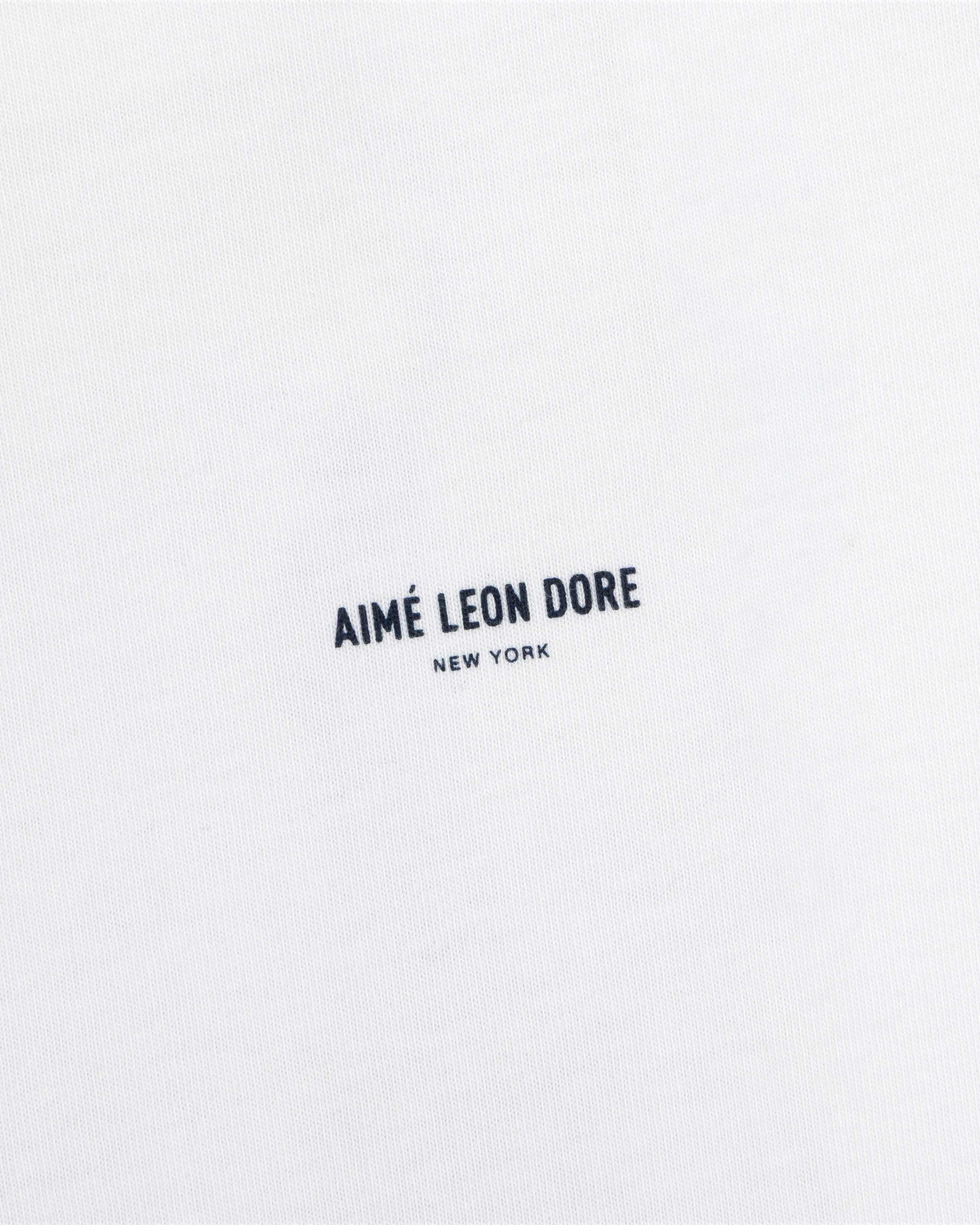 White Long-Sleeve Sailing Tee with black Aimé Leon Dore New York text printed in the center.