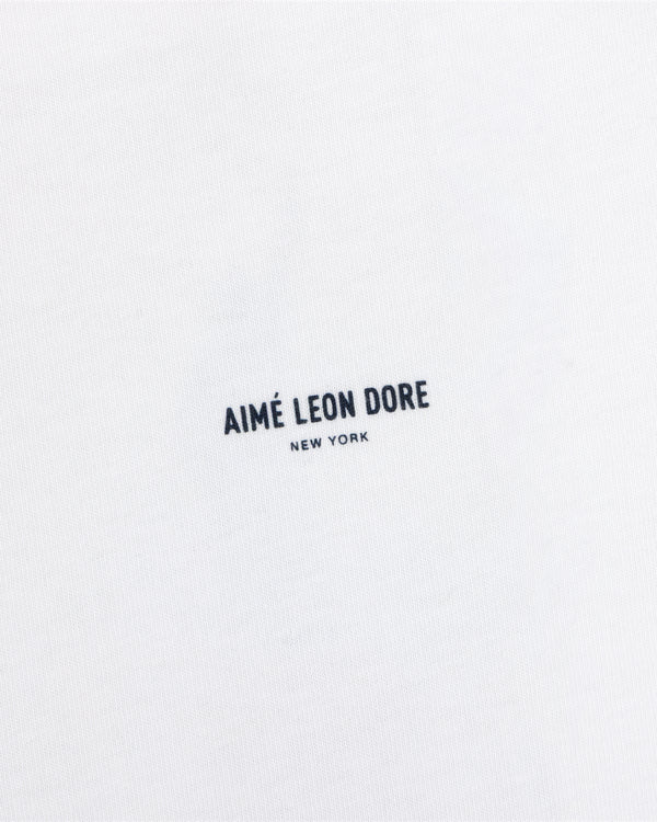 White Long-Sleeve Sailing Tee with black Aimé Leon Dore New York text printed in the center.