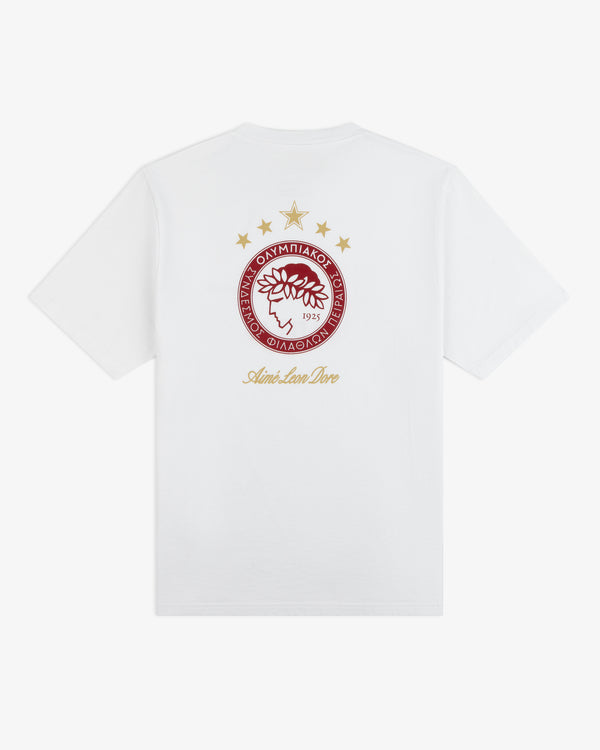 White ALD / Olympiacos F.C. Souvenir Tee with a red circular logo, gold stars, and script text on the back.