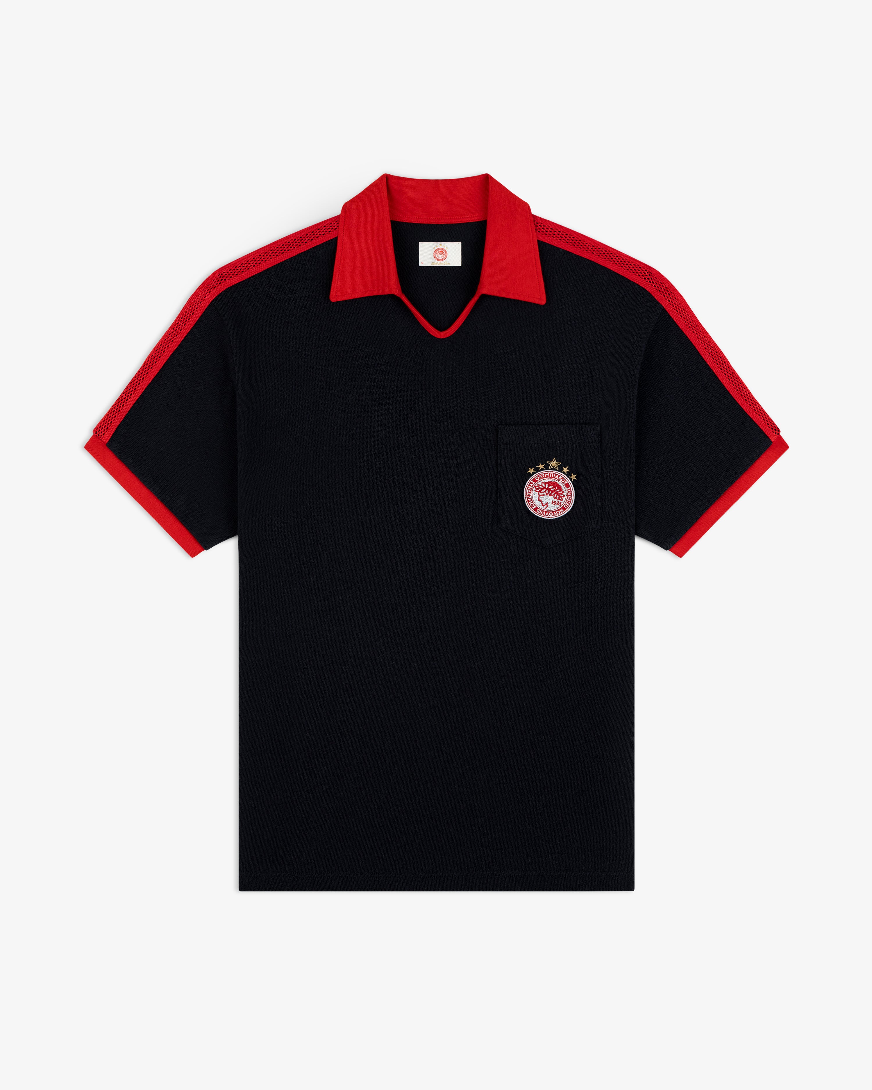 ALD / Olympiacos F.C. Heritage Ringer Polo: black short-sleeved shirt with red collar, cuffs, mesh panels, and chest emblem.