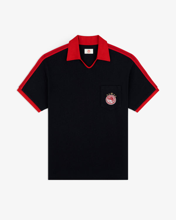 ALD / Olympiacos F.C. Heritage Ringer Polo: black short-sleeved shirt with red collar, cuffs, mesh panels, and chest emblem.