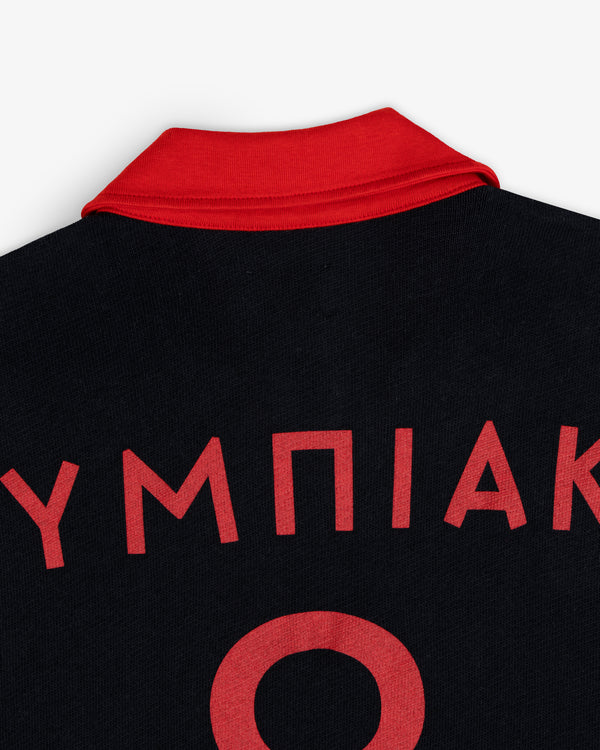 ALD / Olympiacos F.C. Heritage Ringer Polo in black with a red collar, Greek lettering, and a large red number on the back.