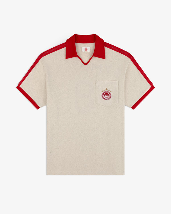 ALD / Olympiacos F.C. Heritage Ringer Polo: beige short-sleeve shirt with a red collar, sleeve cuffs, stripes, and pocket.