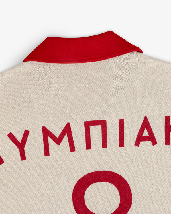 ALD / Olympiacos F.C. Heritage Ringer Polo: an off-white polo shirt with a red collar and red Greek lettering on the back.