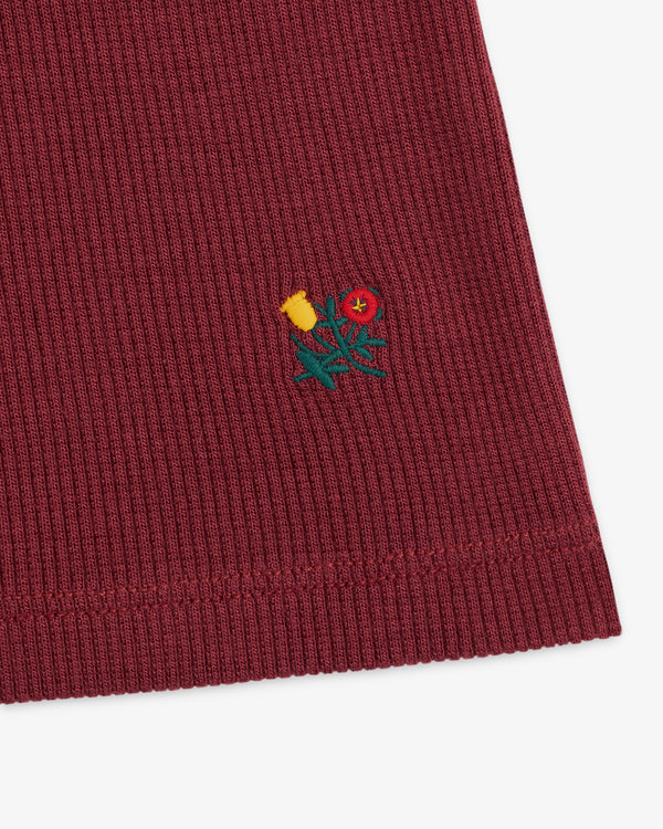 Maroon ribbed Ribbed Mockneck Long-Sleeve Tee with a small embroidered floral design.