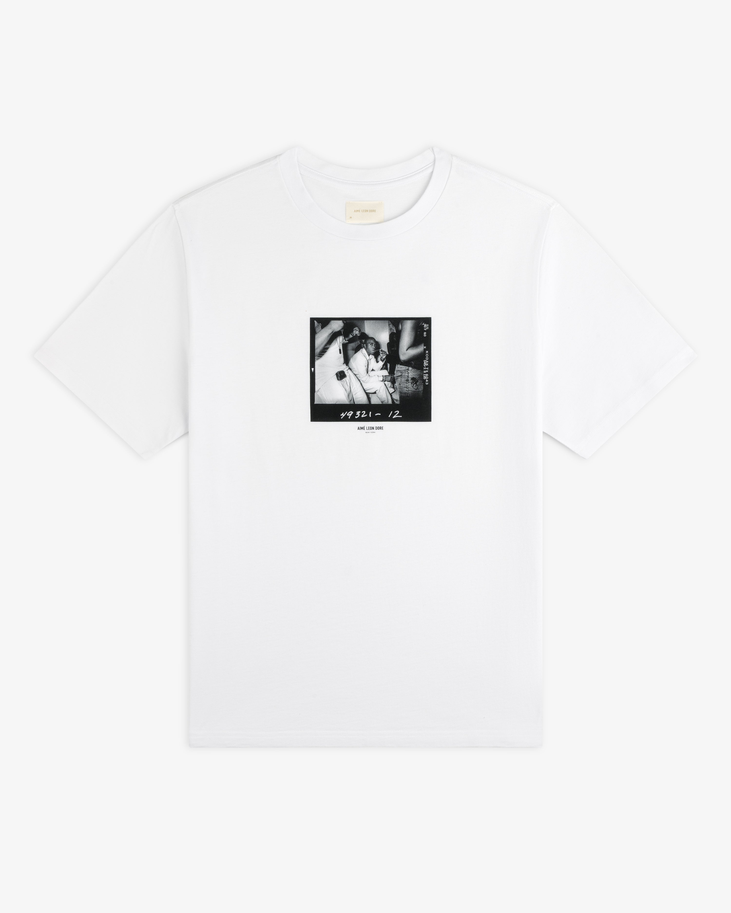 The Esco Tee is a white t-shirt with a square, black and white photograph graphic on the chest featuring 49321 - 12.