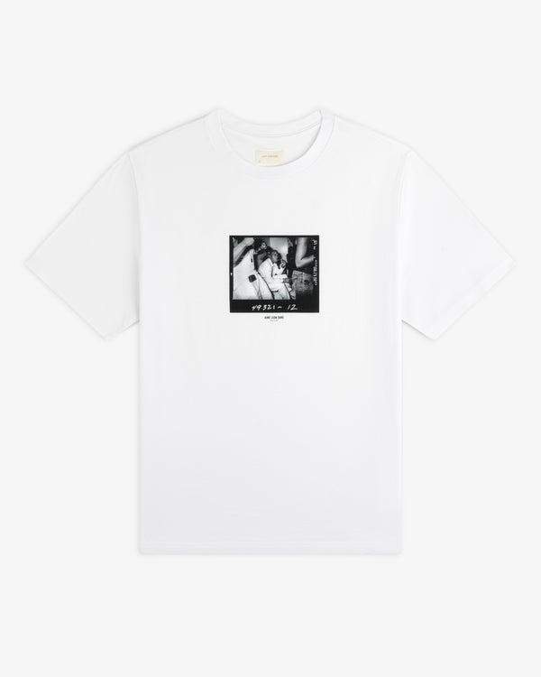 The Esco Tee is a white t-shirt with a square, black and white photograph graphic on the chest featuring 49321 - 12.