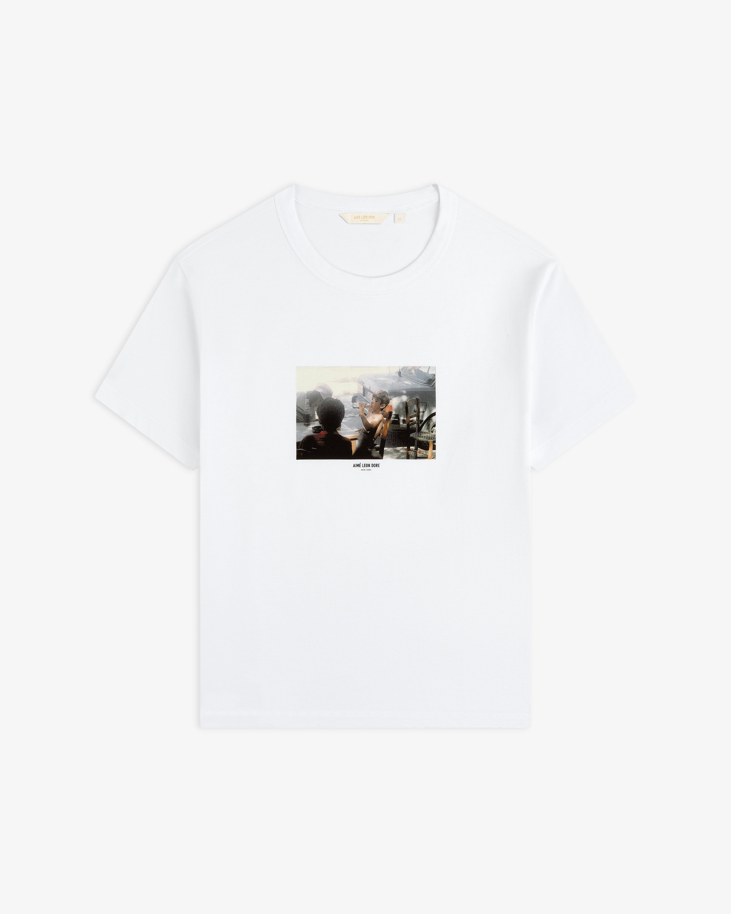 White Agóri Photo Tee featuring a vintage-style photographic print of people at an outdoor café on the chest.