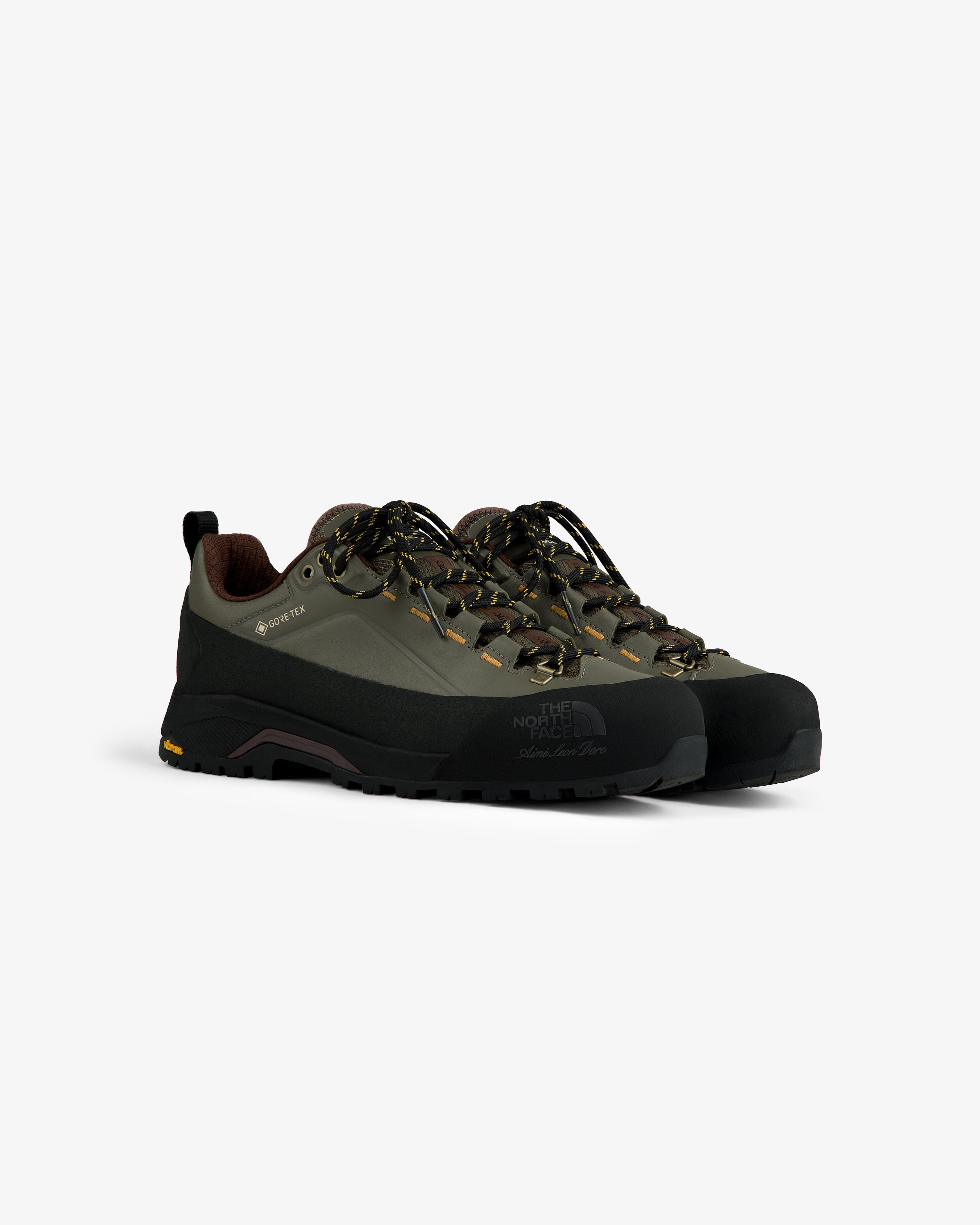 ALD/The North Face Verto Alpine GORE-TEX hiking shoes in green/black with patterned laces on a white background.