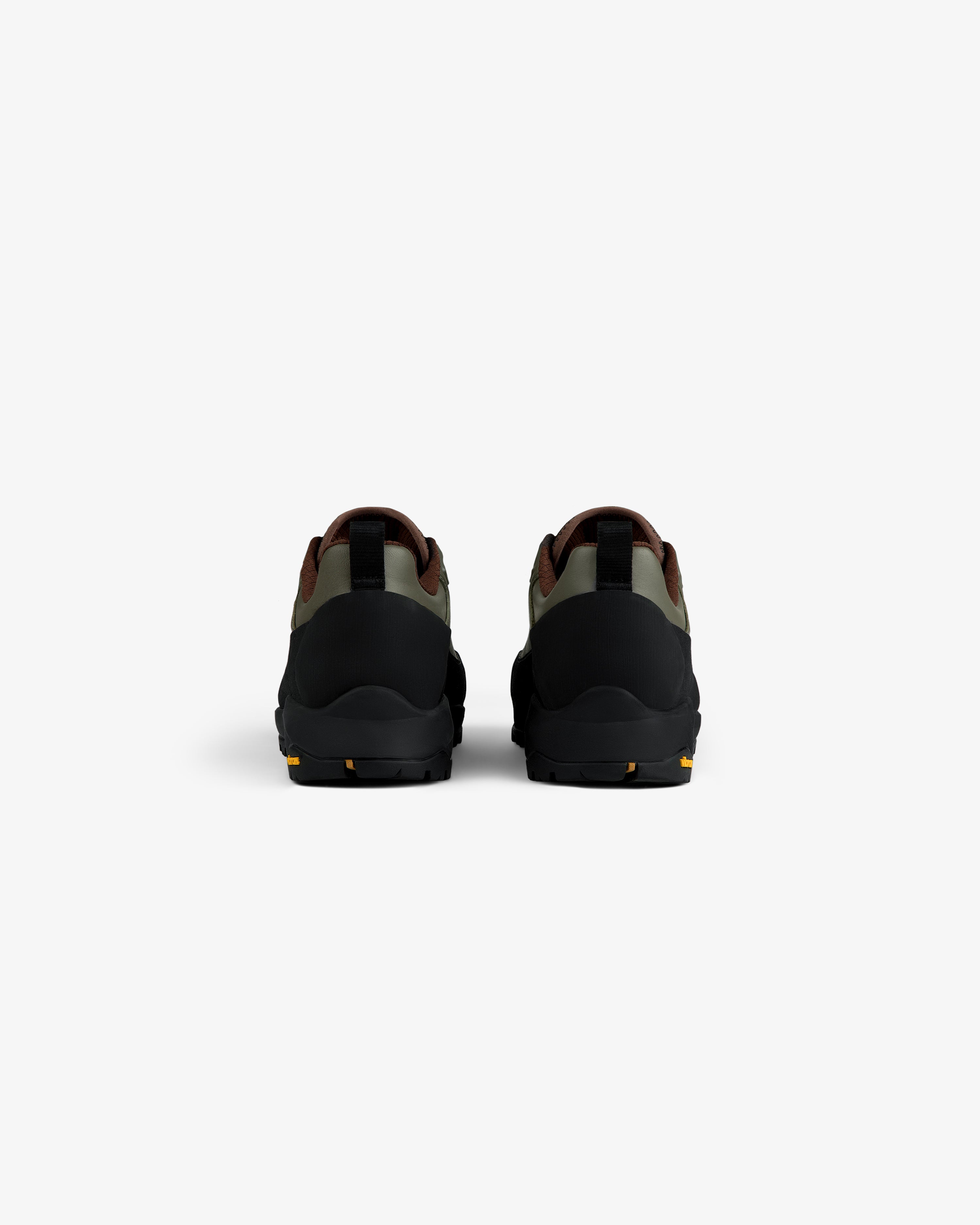 ALD/The North Face Verto Alpine GORE-TEX Hiking Shoes in green, brown & black seen from the back on a white background.