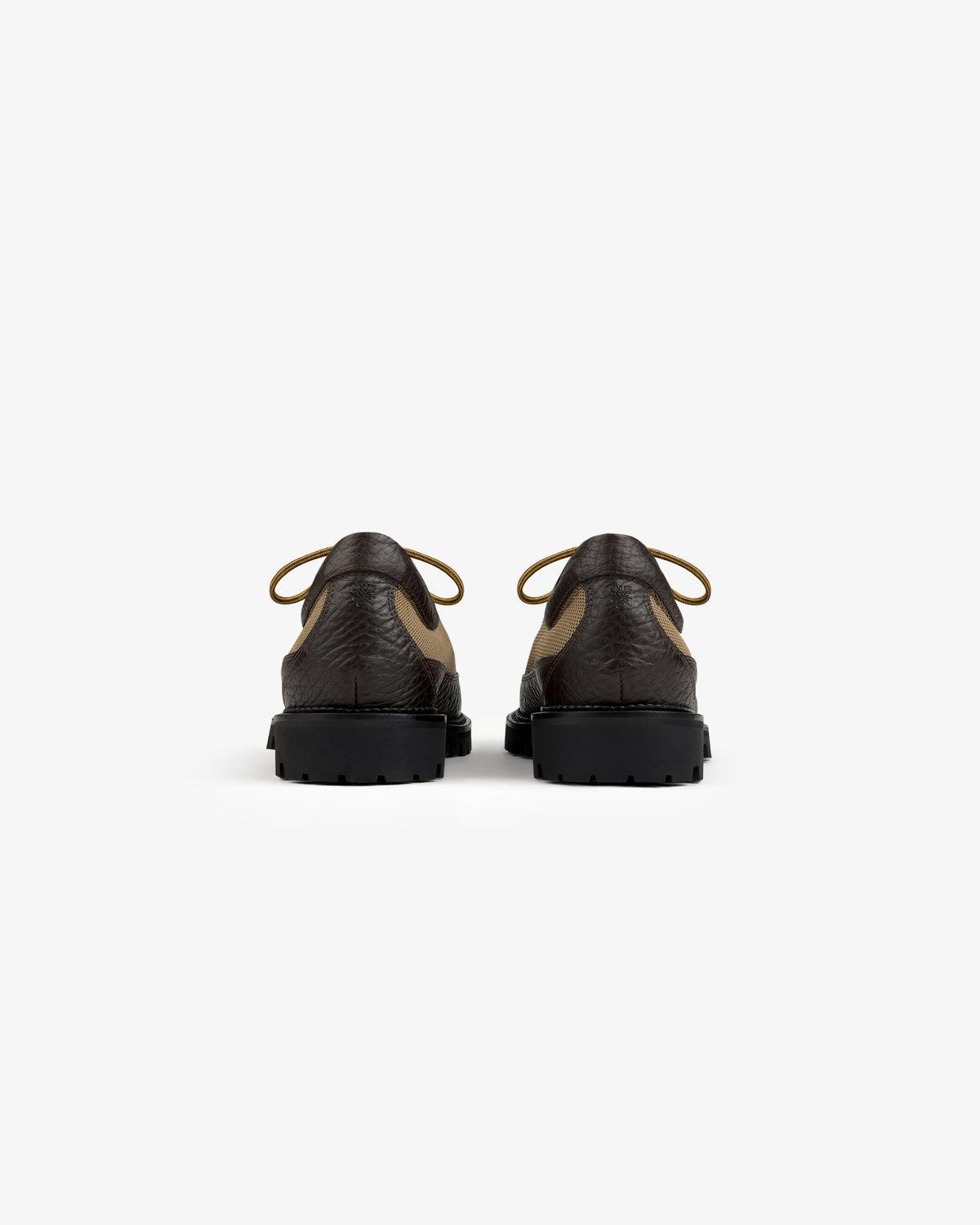 Back view of two brown and tan Field Boot lace-up shoes with thick black lug soles.