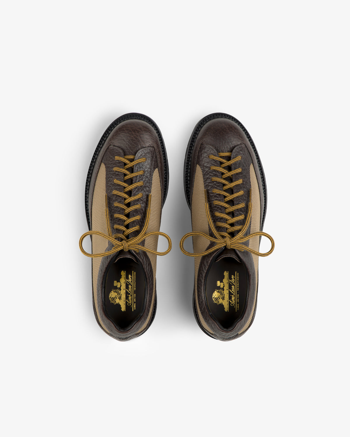 Top-down view of brown and tan Field Boot lace-up boots with gold laces.