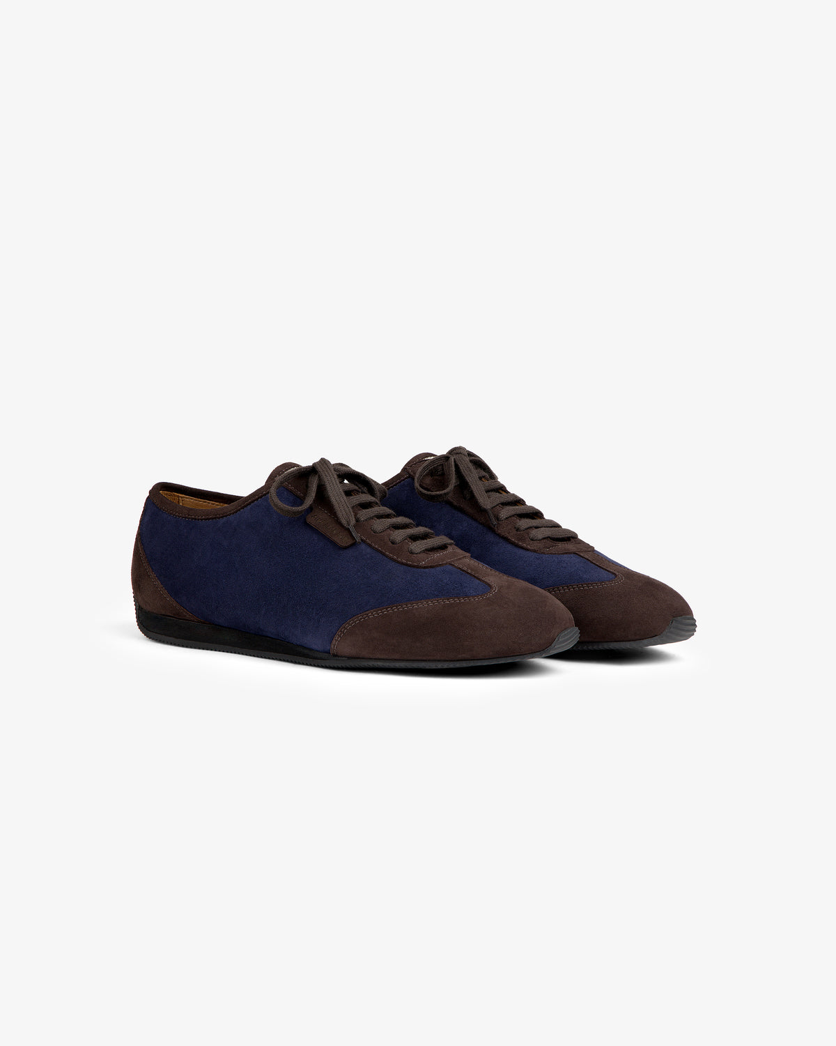 Low Profile Suede Trainer featuring a low-profile lace-up design with navy blue and dark brown suede panels.