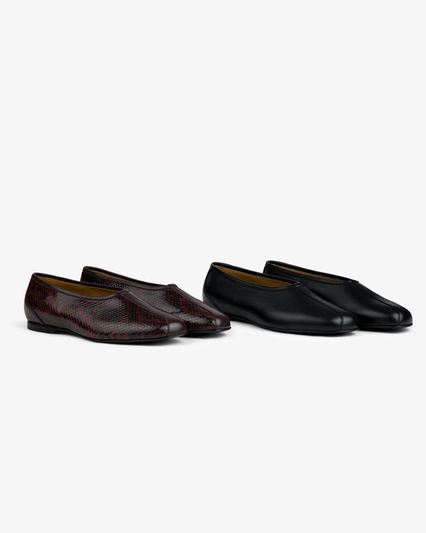 Two pairs of Leather Ballet Flat slip-ons, one in a dark snakeskin pattern and one in solid black.