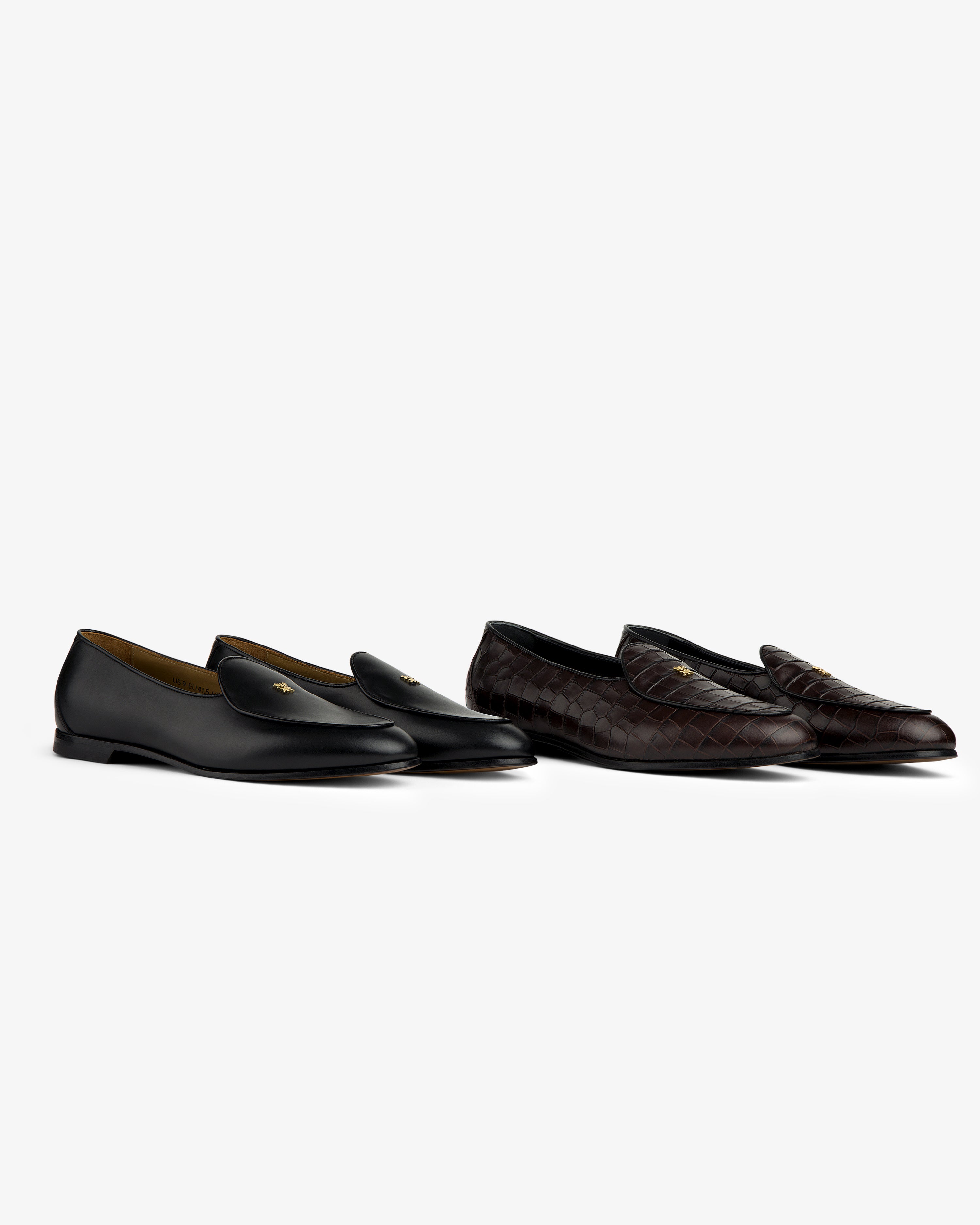 Two pairs of Croc-Embossed Crest Salóni Loafers: one black with gold detail, one dark brown quilted, on white.