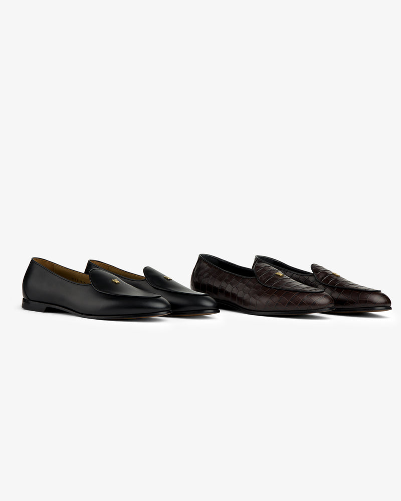 Two Crest Salóni loafers—one black, one dark brown quilted—shown on a white background.