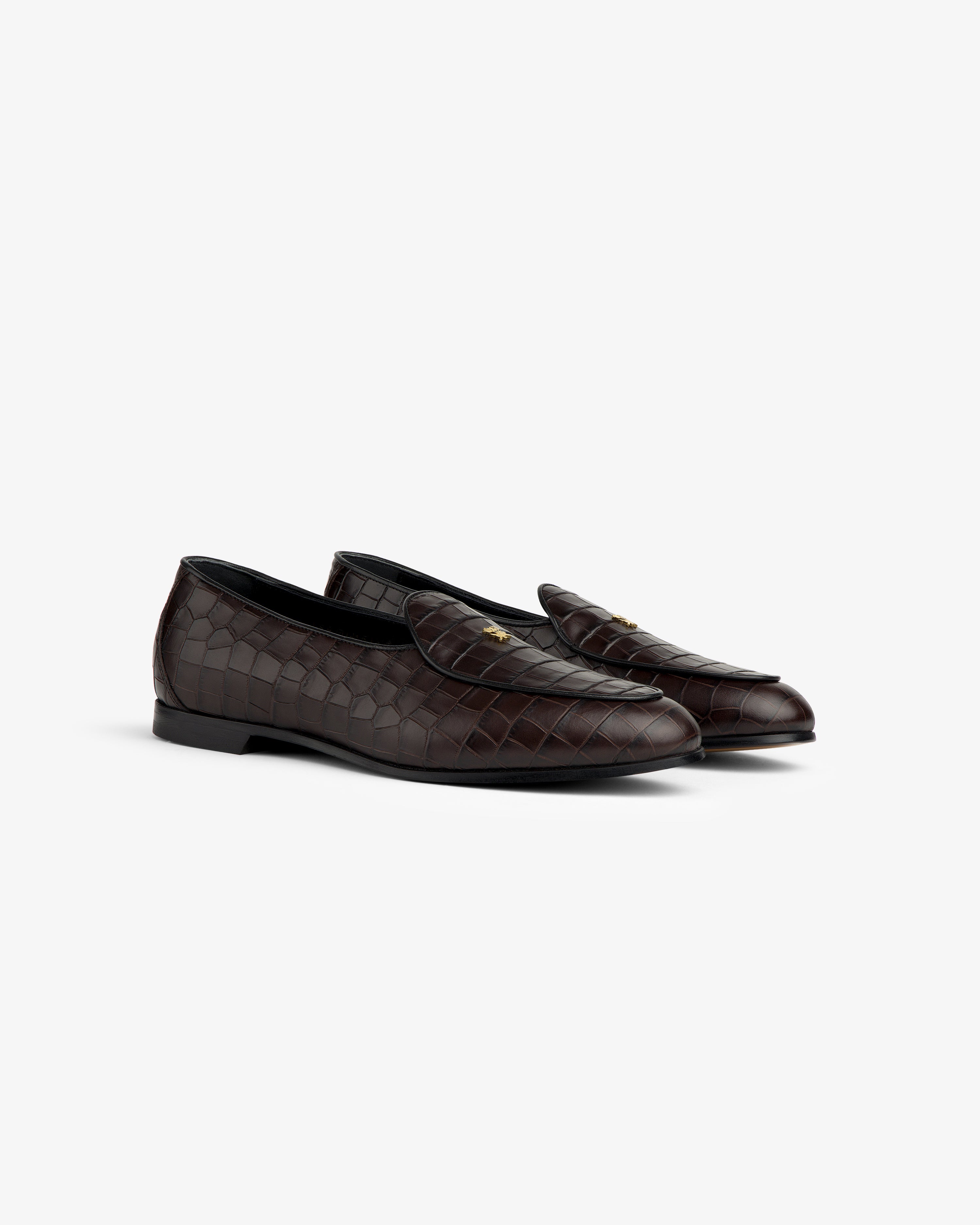 Croc-Embossed Crest Salóni Loafer in dark brown leather with gold emblem, shown on a plain white background.