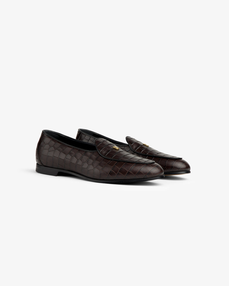 Croc-Embossed Crest Salóni Loafer in dark brown leather with gold emblem, shown on a plain white background.