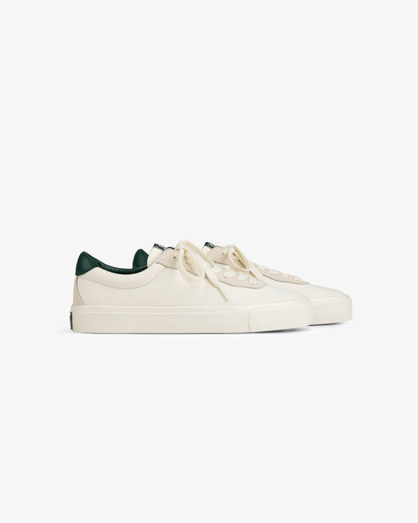 ALD / Last Resort AB VM001-LO Canvas sneakers in cream with green accents and laces on a white background.