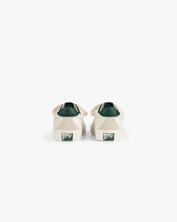ALD / Last Resort AB VM001-LO Canvas white sneakers with green accents, shown from the back on a white background.