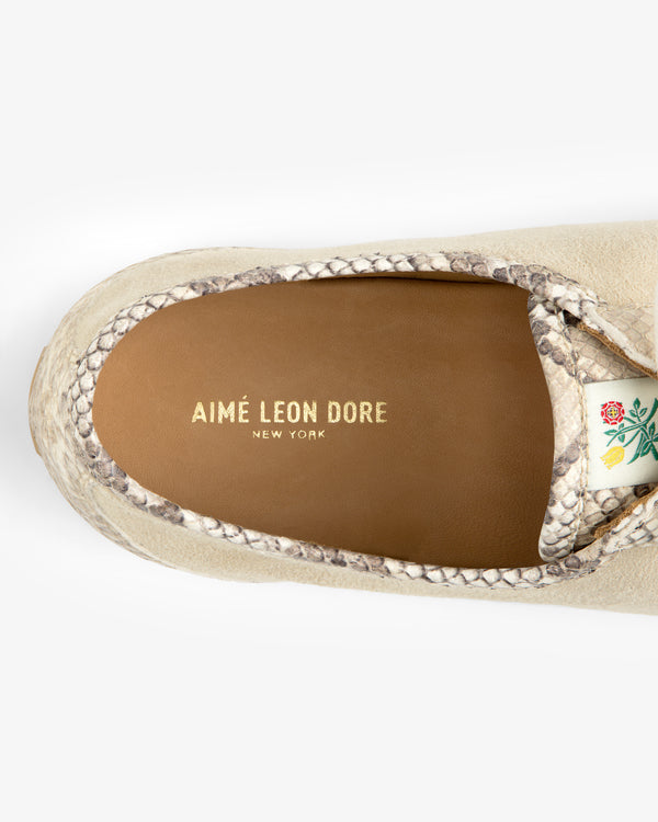 Top-down view of a beige Snake Print Low Profile Suede Trainer with snakeskin trim and a tan insole with gold text.