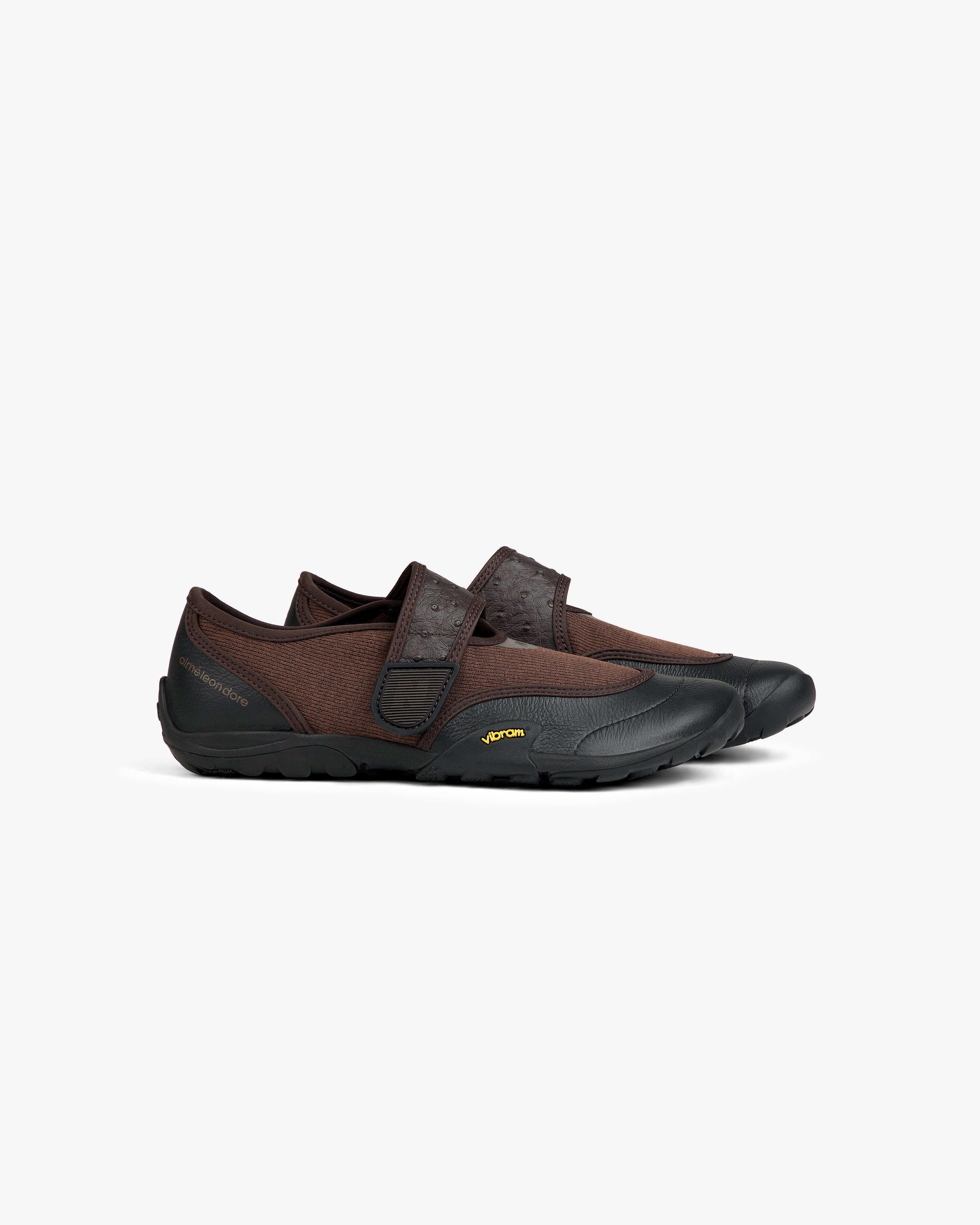 ALD / New Balance MT2 brown slip-on shoes with a textured strap and black rubber soles.
