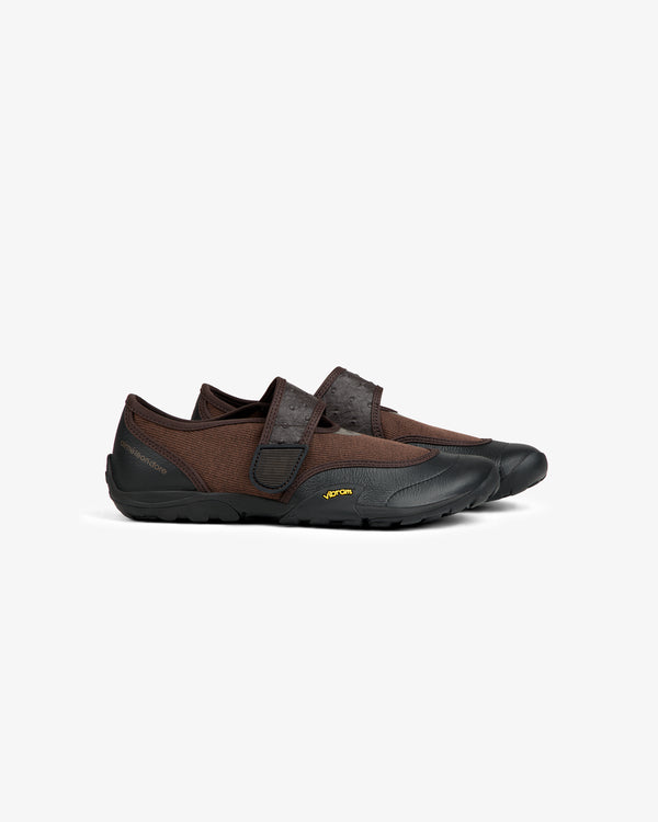 ALD / New Balance MT2 brown slip-on shoes with a textured strap and black rubber soles.