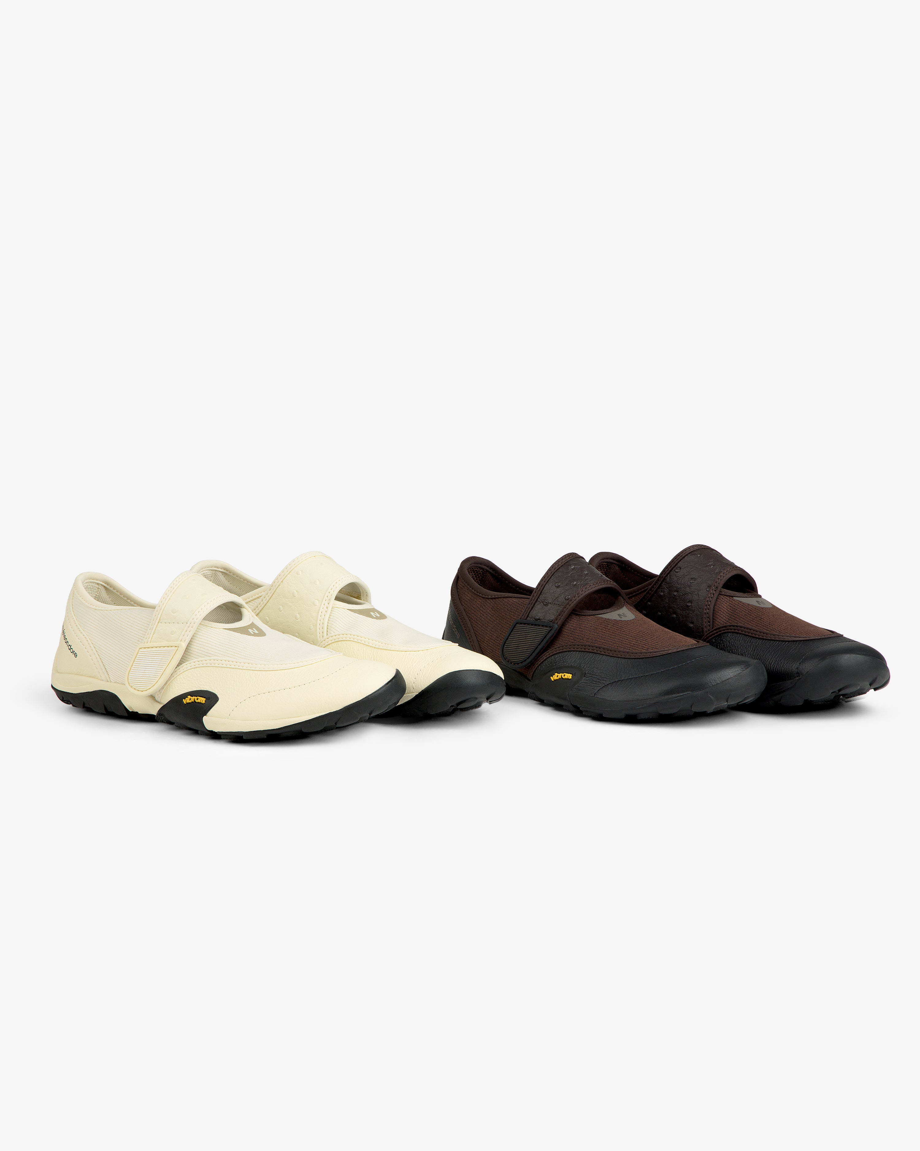 ALD / New Balance MT2 low-profile athletic shoes with velcro straps and black rubber soles, one cream and one brown.