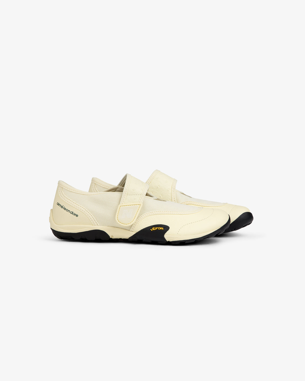 Cream-colored ALD / New Balance MT2 slip-on shoe with a hook-and-loop strap and black lugged rubber sole.