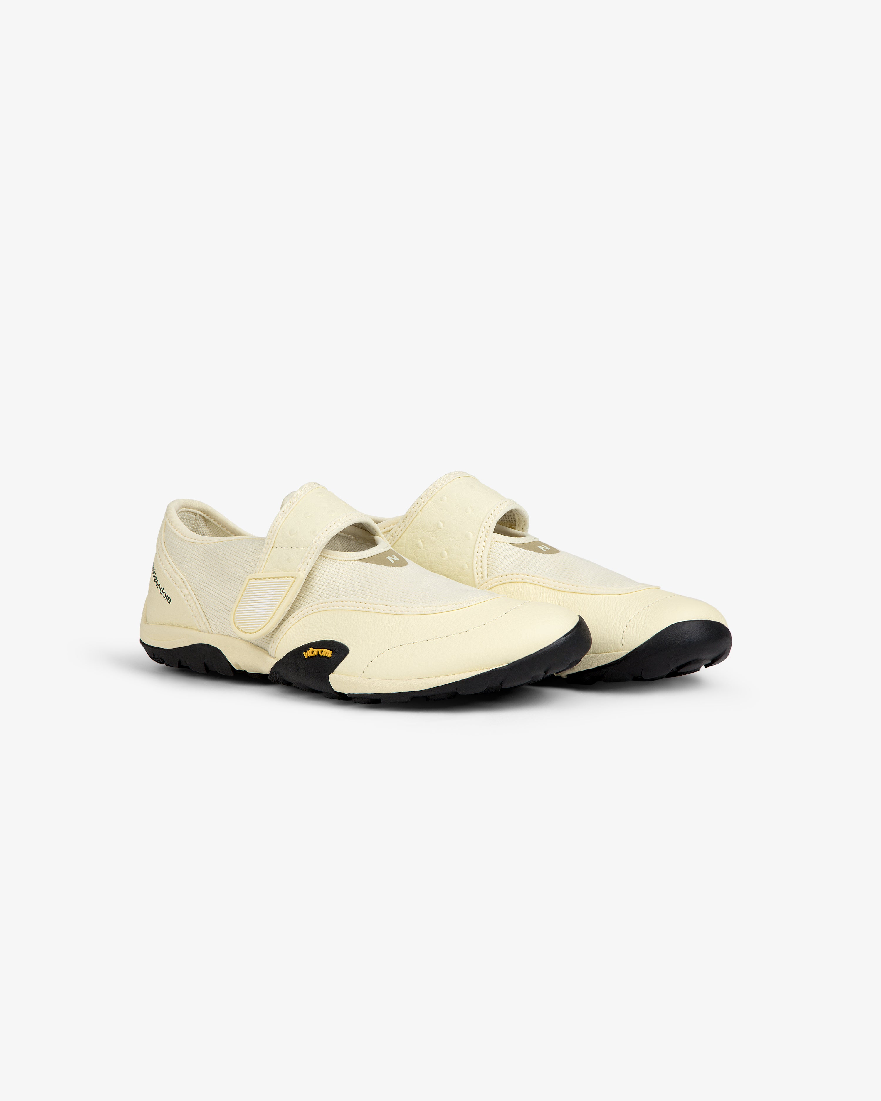 Off-white ALD / New Balance MT2 slip-on shoe with a hook-and-loop strap and a black lugged sole.