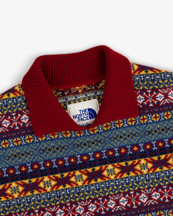 ALD / The North Face Fair Isle Knit Polo with a red collar and blue, yellow, and red geometric patterns.