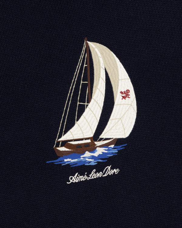 Regatta Embroidered Crewneck Sweater: Cream sailboat on dark fabric, Aimé Leon Dore in cursive below.