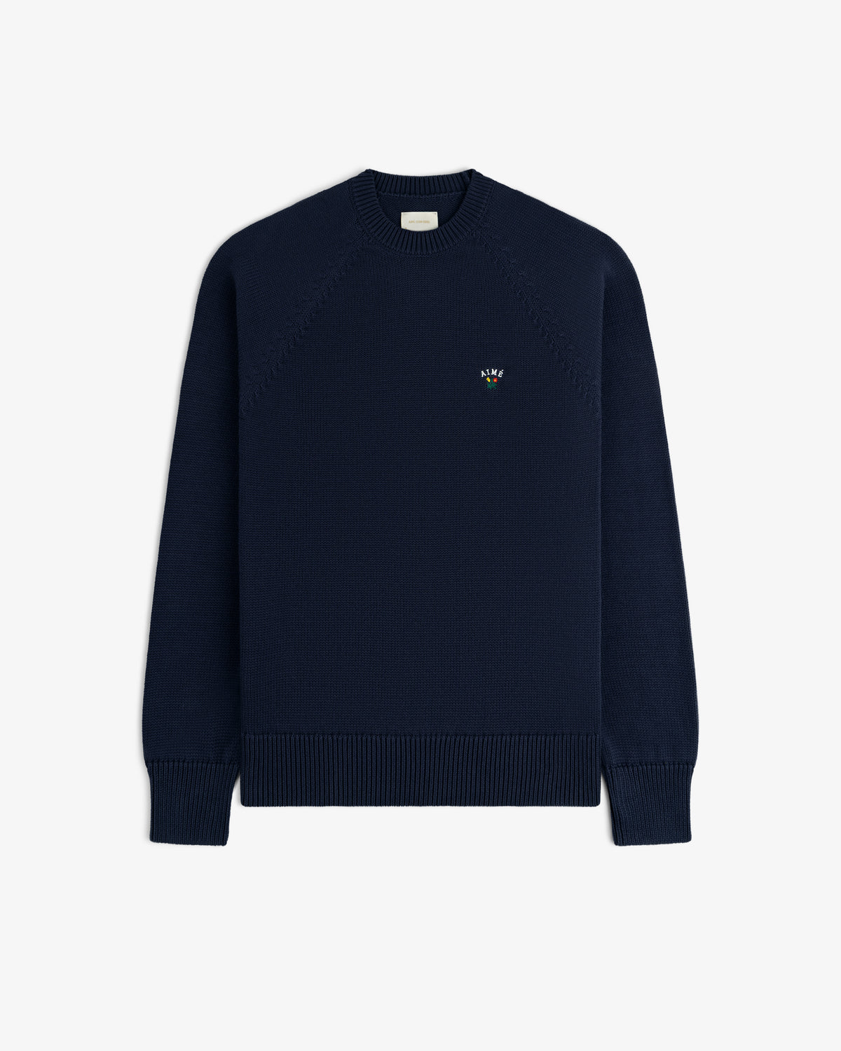 Crest Raglan Sweater: navy crewneck with ribbed cuffs, hem, and an embroidered logo on the left chest.