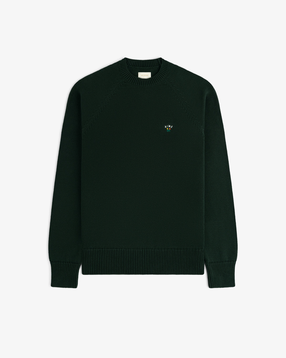 Crest Raglan Sweater—dark green, crewneck, ribbed cuffs/hem, small embroidered logo on left chest.