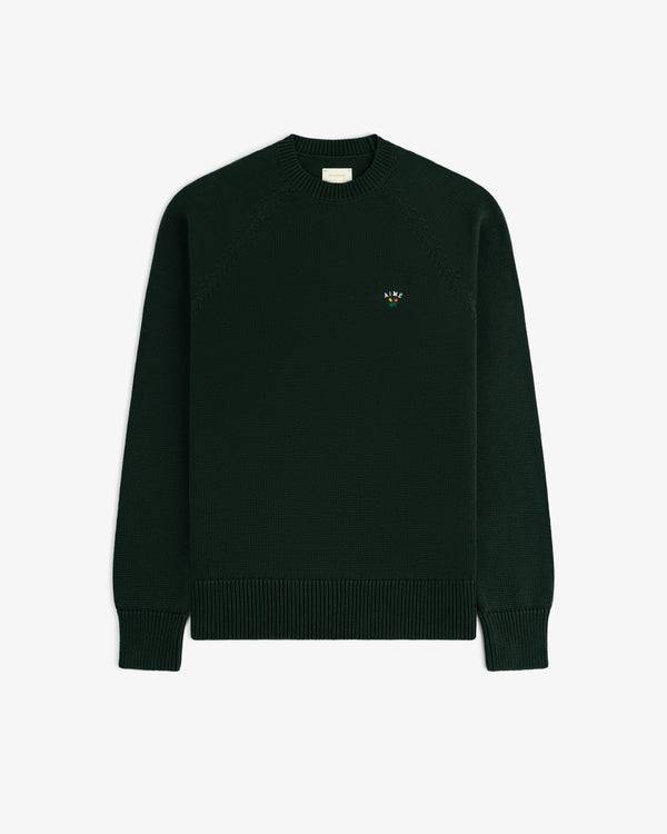 Crest Raglan Sweater—dark green, crewneck, ribbed cuffs/hem, small embroidered logo on left chest.