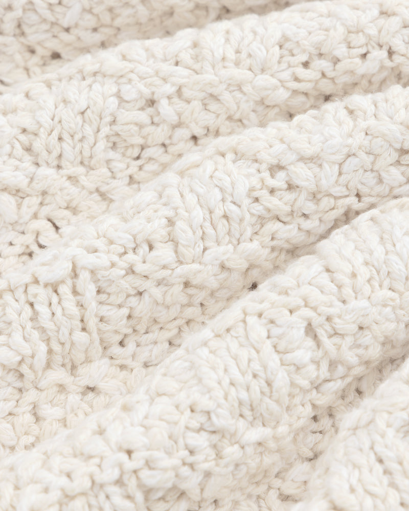 Close-up of the off-white Checkerboard Bouclé Sweater featuring a textured checkerboard pattern.