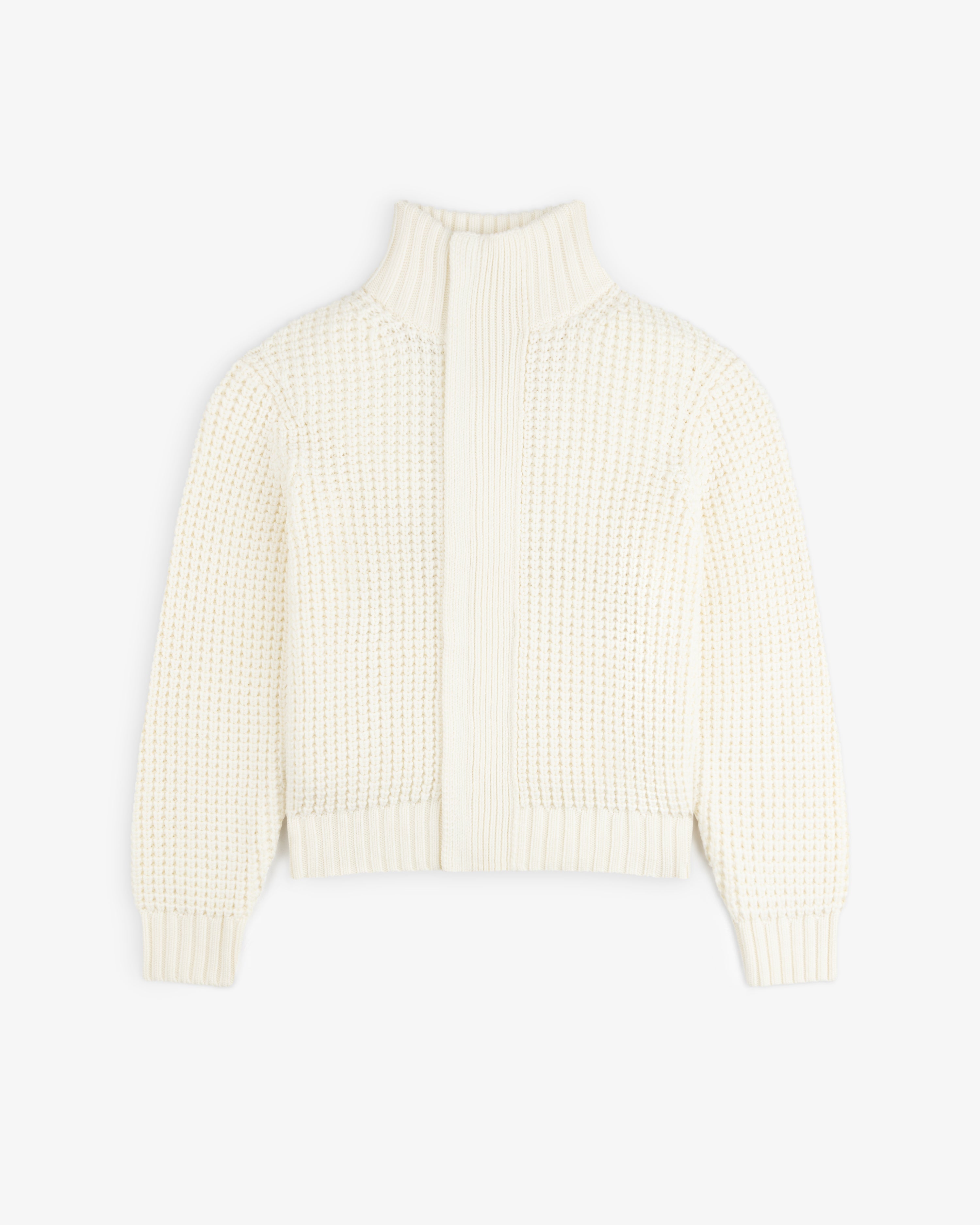 Off-white Merino Wool Full Zip Sweater with a high ribbed collar and a waffle-knit texture.