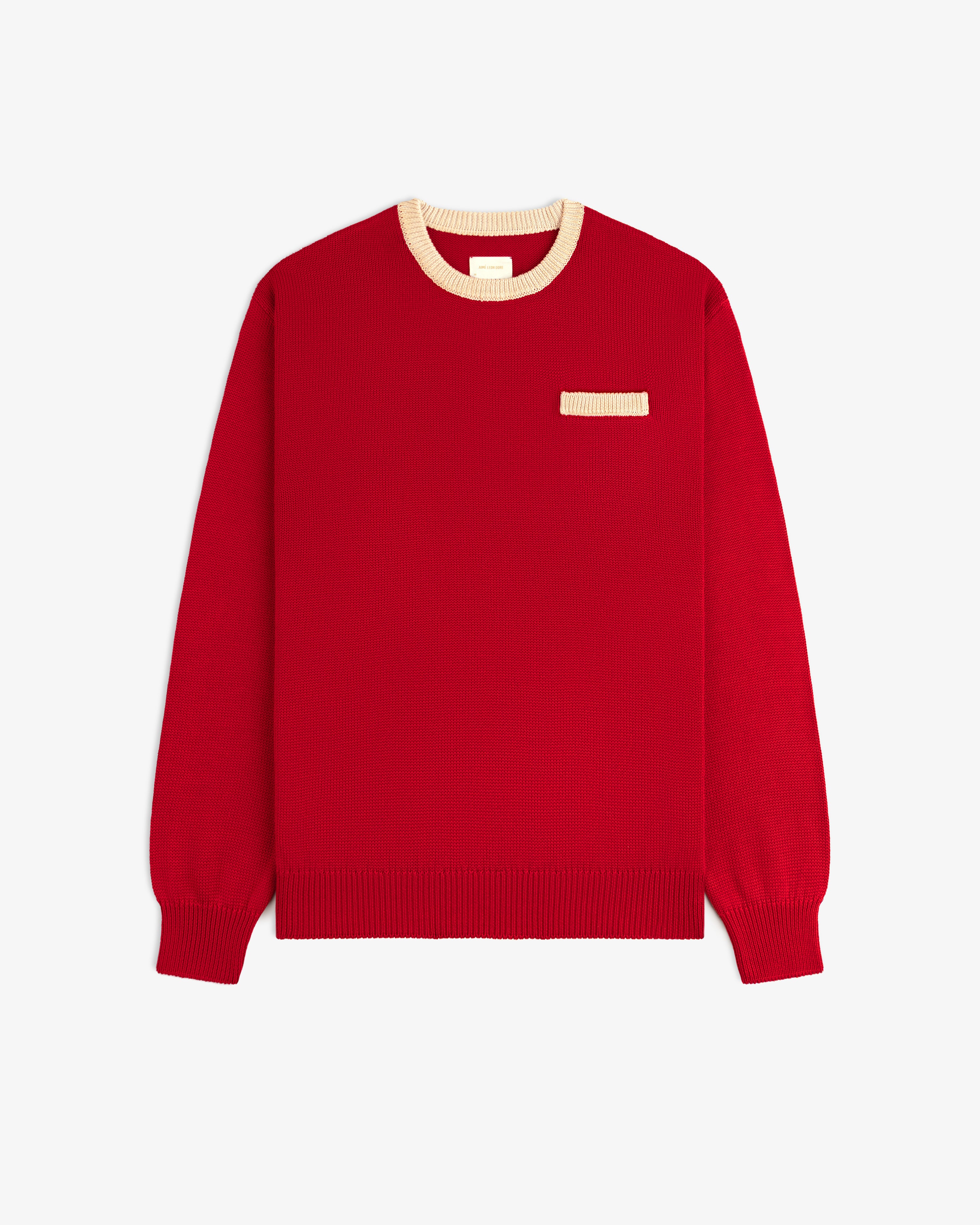 Knit Pocket Crewneck Sweater in red with a contrasting cream ribbed collar and small chest pocket.