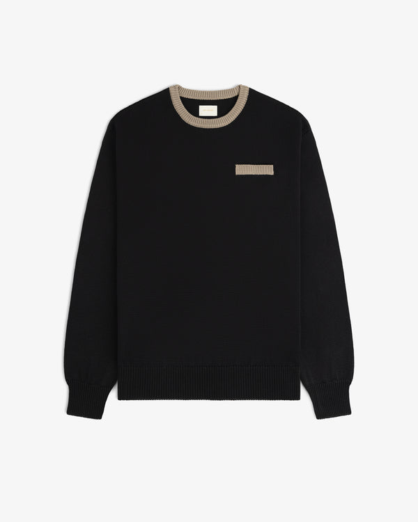 Knit Pocket Crewneck Sweater in black with a contrasting tan ribbed collar and a small matching chest pocket.