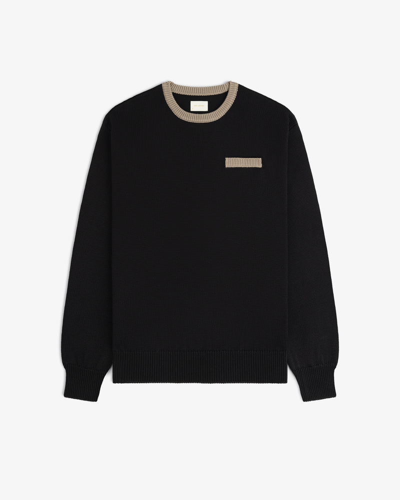 Knit Pocket Crewneck Sweater in black with a contrasting tan ribbed collar and a small matching chest pocket.