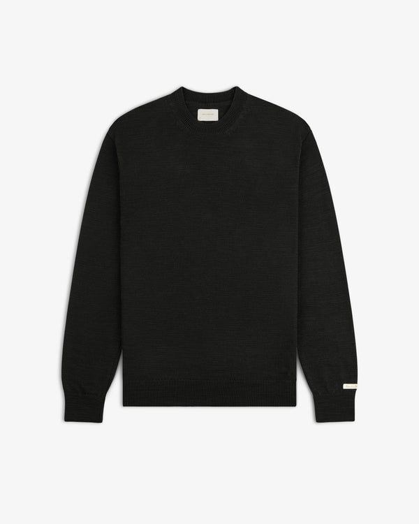 Black Slub Merino Wool sweater with a crewneck, textured knit, and ribbed trim.