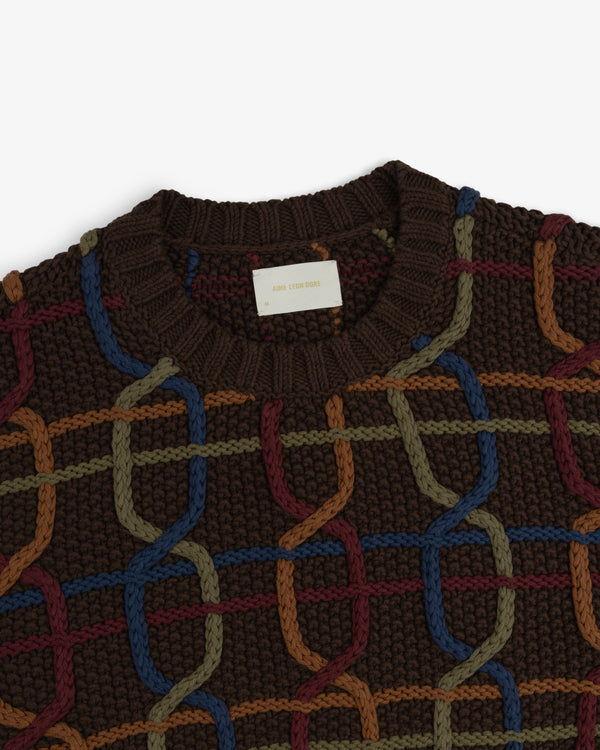 Cable Link Crewneck Sweater in dark brown with a multicolored cable link pattern in blue, red, and olive green.