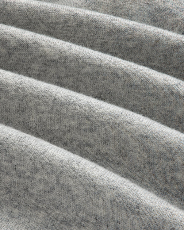 Close-up of folded Full-Zip Pavilion Cashmere Hoodie in light gray, showing its soft texture and visible weave.