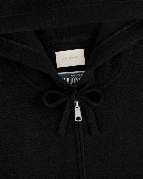 Close-up of Full-Zip Pavilion Cashmere Hoodie zipper with tied strings and label inside the collar.