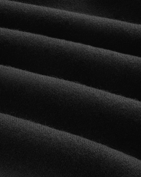 Close-up of black, ribbed fabric from the Full-Zip Pavilion Cashmere Hoodie, showing soft texture and diagonal grooves.